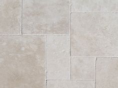 a close up view of a white tile floor