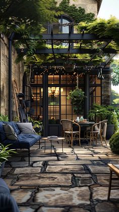 an outdoor patio with furniture and plants