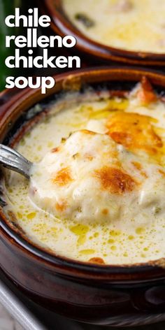 two brown bowls filled with chicken soup on top of a table