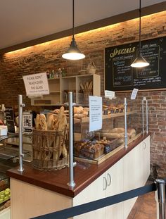 a bakery with breads and pastries on display