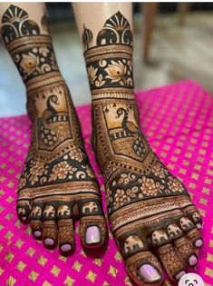 the feet are decorated with henna designs