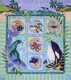 a quilt with animals and fish on it