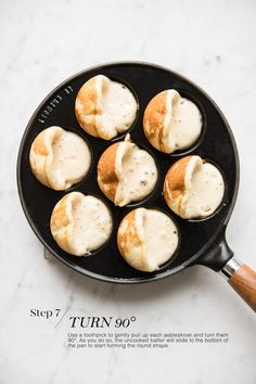 some food is cooking in a pan on the table