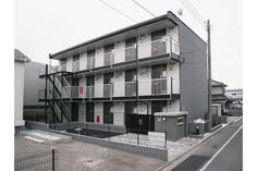 an apartment building with stairs leading up to it