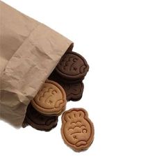 some cookies are sitting in a brown paper bag