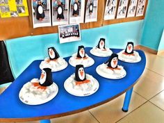 there are many penguins sitting on the table