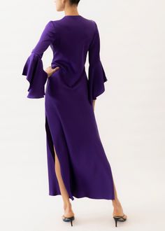 Choose the Rita Purple Dress for a showstopping look on special occasions. This timeless design is crafted from luxurious charmeuse silk, presenting a vibrant purple hue that is sure to captivate. Our pieces are majority made to order ensuring that no fabric is wasted and energy is conserved. Once the order is placed we will notify you when it has been made and is shipped out (Approximately 2-3 weeks). If you would like the dress made to your measurements: we can certainly work with you. For mor Long Sleeve Dresses With Satin Finish For Gala, Long Sleeve Satin Finish Dress For Gala, Silk Maxi Dress With Satin Finish For Formal Occasions, Formal Silk Dress With Satin Finish, Silk Crepe Maxi Dress For Party, Fitted Silk Dress With Satin Finish For Cocktail, Purple Silk Evening Dress, Silk Purple Evening Dress, Luxury Satin Maxi Evening Dress