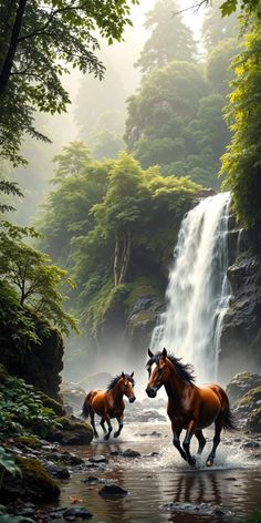 two horses running in front of a waterfall