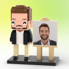 an image of a man with a beard next to a lego photo frame on a stand