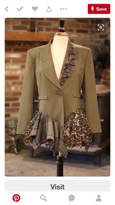 a mannequin wearing a green jacket and leopard print scarf on it's lapel