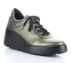 Elevate your casual look with the Fly London metallic leather fashion sneaker. Designed for ultimate comfort, this lightweight lace-up shoe features a genuine leather upper and a rounded toe shape. The super cool wedge heel adds a stylish lift to your steps. From Fly London. Fly London Shoes, London Shoes, Fly London, The Fly, Metallic Leather, Casual Look, Lace Up Shoes, Leather Fashion, Wedge Heels