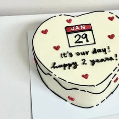 a heart shaped cake with the date 29 it's our day