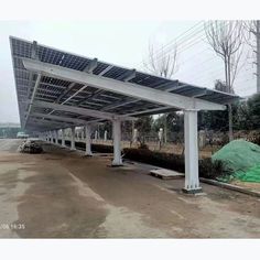 an empty parking lot with solar panels on the roof