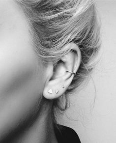 black and white photograph of woman with ear piercings