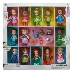 an assortment of disney princess dolls in a box