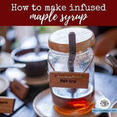 a jar filled with maple syrup sitting on top of a table