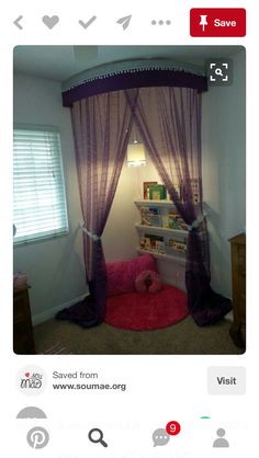 a room with a bed, book shelf and pink rug on the floor in front of it