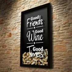 a sign that is on the side of a brick wall with wine corks in front of it