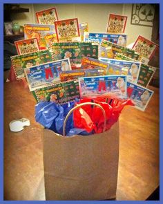 a bag filled with lots of cards on top of a wooden table