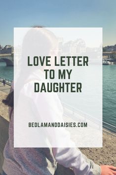 a woman looking out over the water with her back to the camera and text that reads love letter to my daughter