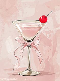 a martini glass with a cherry on the rim and a pink bow around the rim