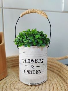 a white flower pot sitting on top of a table