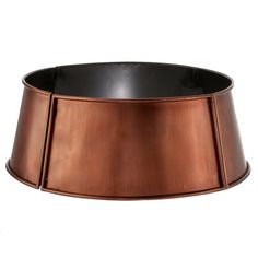 a large copper metal bowl on a white background