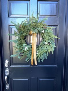 a wreath on the front door of a house