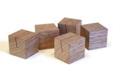 several wooden cubes sitting on top of each other in front of a white background