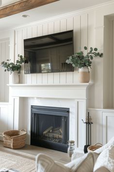 a living room with a fireplace and tv above it