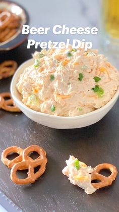 a bowl of chicken salad with pretzels on the side