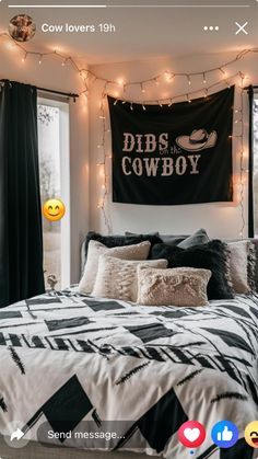 a black and white bed room with lights on the wall, pillows and blankets hanging from the ceiling