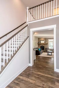 an open floor plan with stairs leading to the living room