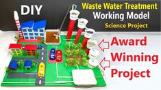 an award winning project is displayed in front of a sign that says waste water treatment working model science project