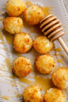 some fried food on a plate with a honey comb