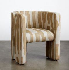 a zebra print chair sitting on top of a cement floor