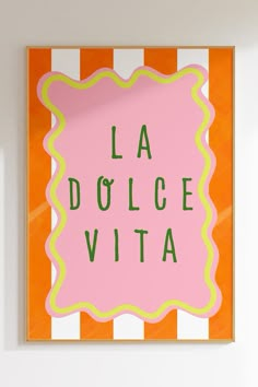 a pink and yellow sign that says la dolce vita