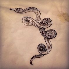 a drawing of a snake on a white sheet that has been drawn with black ink