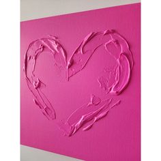 a pink heart painted on the wall