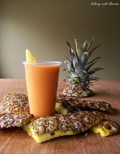 there is a pineapple drink next to some crackers