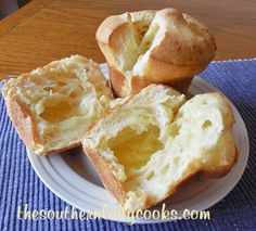 three pieces of bread sitting on top of a white plate next to a blue place mat