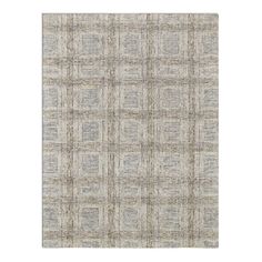 an area rug with grey and white squares on it