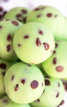 green chocolate chip cookies stacked on top of each other with holes in the middle and one cookie missing