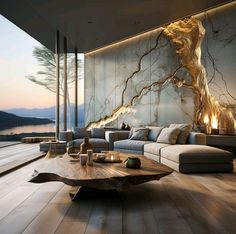 a living room with wood flooring and large glass windows overlooking the water at sunset