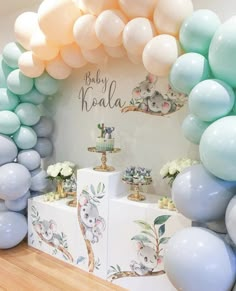 a baby koala themed party with balloons and decorations