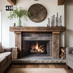 a living room with a fire place in the center and wood logs on the floor