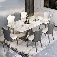 a dining room table with chairs around it