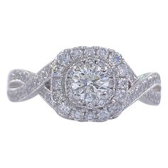 Neil Lane Bridal Style: Double Halo & Twisted Band Engagement Ring SKU Number: #940447410 Metal: 14K White Gold Size: 5.25 sizable Total Carat Weight: 7/8 TCW / 0.87 tcw Center Diamond Shape: Round Brilliant Diamond 0.33CTS Accent Diamonds: Round Diamonds 66 Stones 0.54 TCW Diamond Color & Clarity: I / I1 Hallmark: "Neil Lane" signature "14kt " Includes: -Certified Appraisal -Elegant Ring Box Retail Value: $2,499.99 SKU#11500TSD070921 Twisted Band Engagement Ring, Neil Lane, Engagement Rings Twisted, Round Engagement Rings, Twisted Band, Round Diamond Engagement Rings, Band Engagement Ring, American Diamond, Elegant Ring