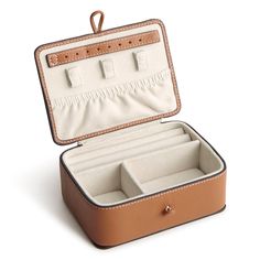 an open suitcase with three compartments on the inside and two drawers in the outside, sitting on a white surface