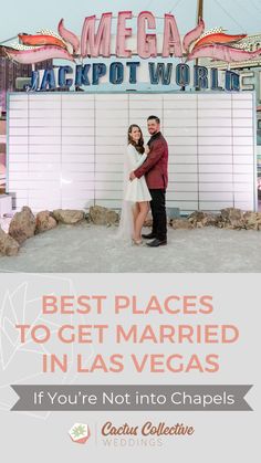 two people standing in front of a sign that says best places to get married in las vegas